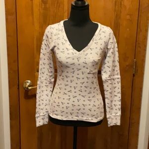 Women’s white thermal top with skates design